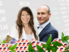Woman and man surrounded by stock market prices